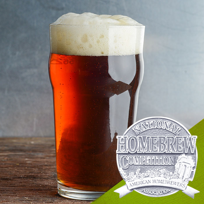 red-brown-colored beer in pint glass