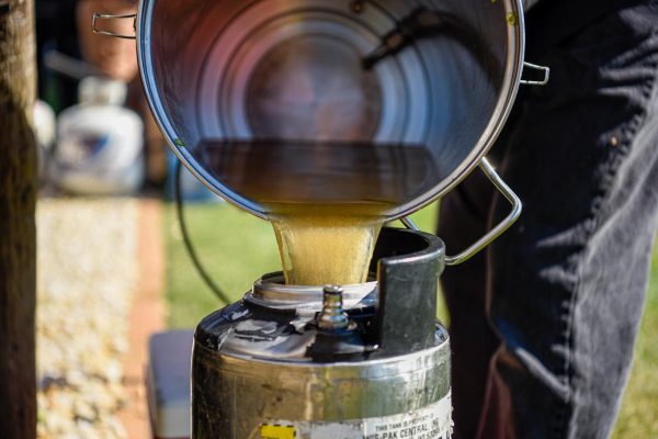 homebrew being poured into keg