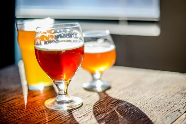 assorted beers in different-shaped glasses