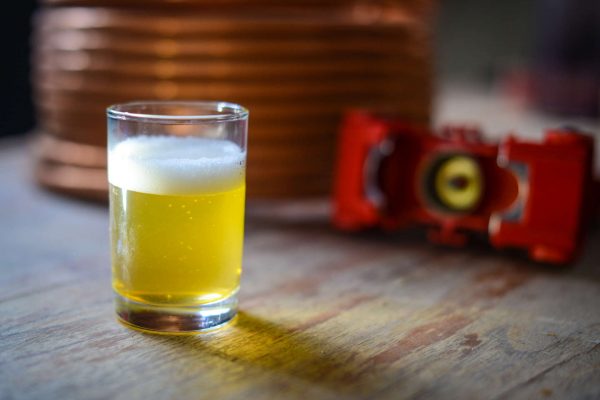 light-colored wheat beer in small glass