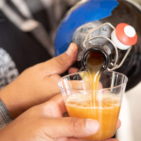 socal cerveceros members pouring beer