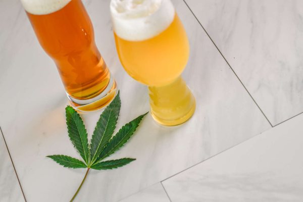 two beers with a marijuana leaf