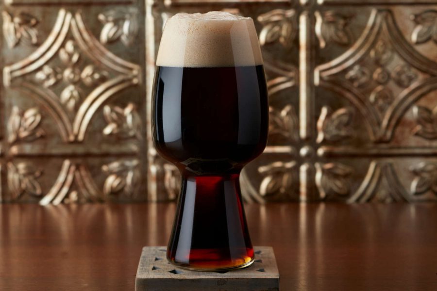 glass of stout on a coaster