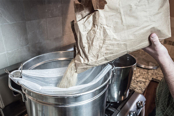 beer grains poured into pot