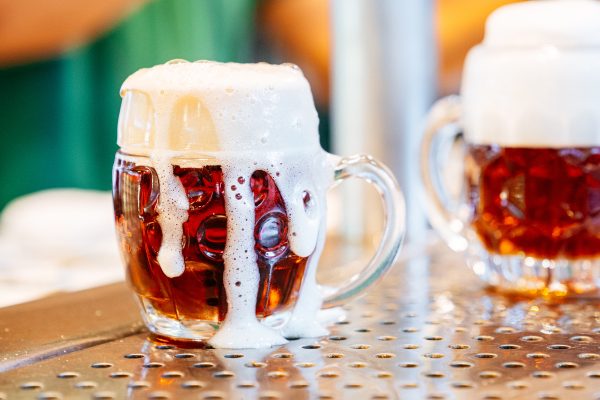 overflowing stein of german beer