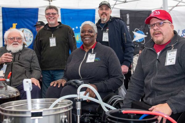 homebrewers around a kettle